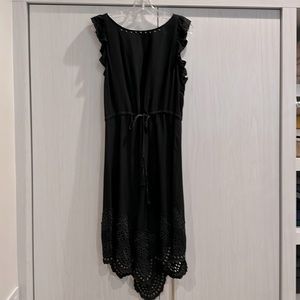 Black sleeveless dress with ruffles, lace and studs